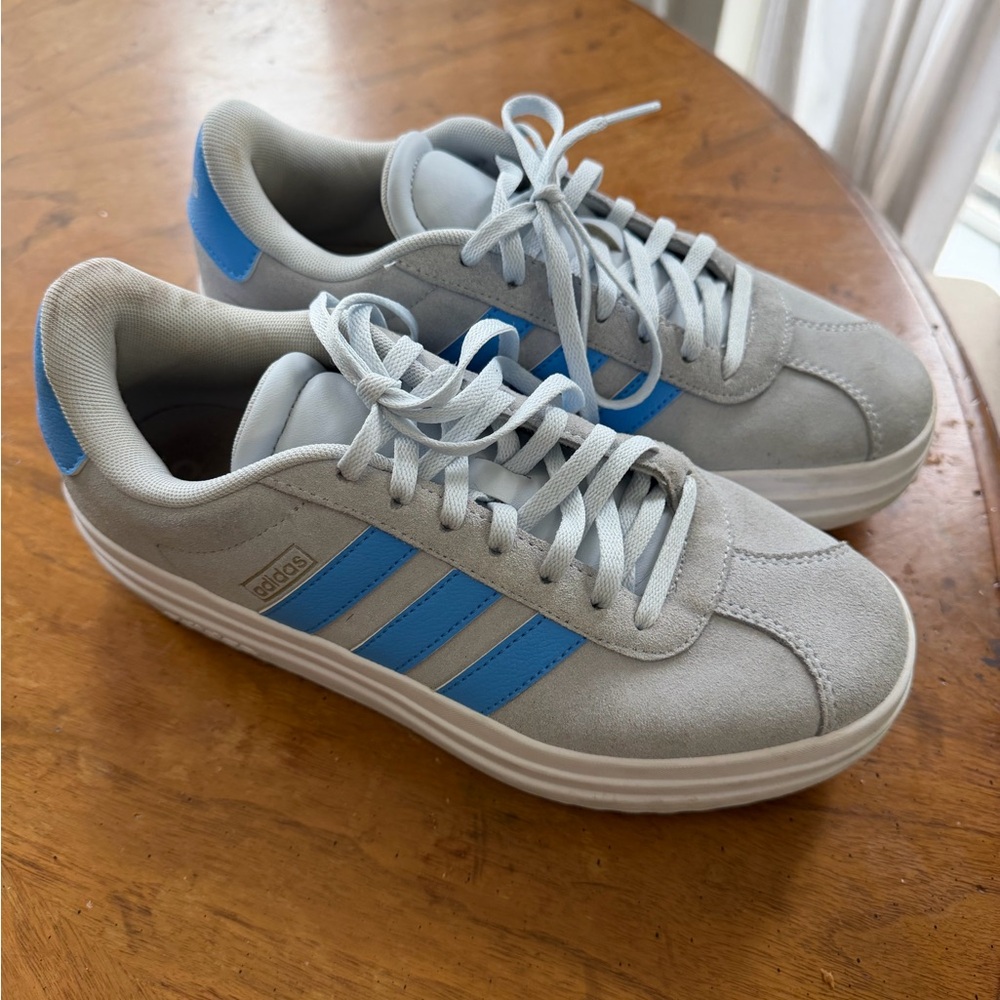 Woman’s blue adidas sneakers